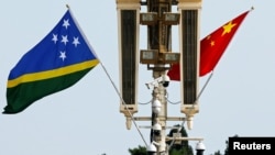 Flags of Solomon Islands and China flutter near the Tiananmen Gate in Beijing, China July 11, 2023.