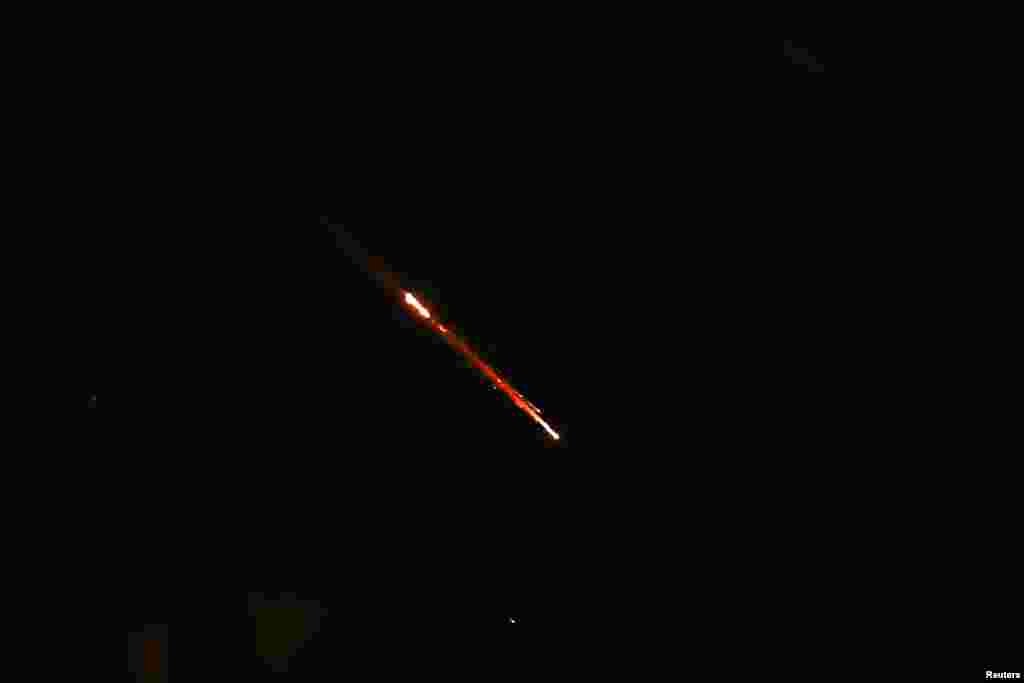 Objects are seen in the sky above Jerusalem after Iran launched drones and missiles towards Israel, in Jerusalem, April 14, 2024.&nbsp;