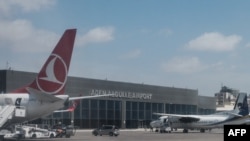 FILE - Airplanes are parked at Aden Adde International Airport in Mogadishu, Somalia, on Feb. 13, 2022.