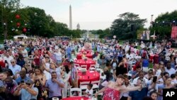 FILE - Attendees listen as President Joe Biden speaks during an Independence Day celebration on July 4, 2021. (AP Photo)