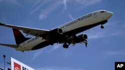 FILE - A Delta Air Lines jet prepares to land at Los Angeles International Airport, in Los Angeles, March 15, 2022.