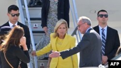 US first lady Jill Biden (C) is welcomed as she arrives to celebrate the US rejoining UNESCO, at the Orly Airport in Orly, Paris' suburb, on July 24, 2023. 