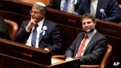 FILE - Israeli right-wing Knesset member Itamar Ben Gvir, left, and Bezalel Smotrich look on during the swearing-in ceremony for Israeli lawmakers at the Knesset, Israel's parliament, in Jerusalem, Nov. 15, 2022.