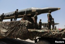 Houthis mark the anniversary of their takeover in Sanaa, Yemen, with a military parade featuring ballistic missiles on September 21, 2023. (Khaled Abdullah/Reuters)