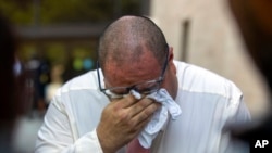 Paul Jamrowski, father and father in-law of two victims of the El Paso Walmart mass shooting, weeps outside federal court in El Paso, Texas, July 5, 2023. Patrick Crusius, accused of nearly two dozen fatal shootings, received multiple life terms July 7.