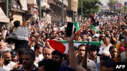 Watu wakiingia barabarani wakati wa maandamano ya kuunga mkono watu wa Palestina baada ya sala ya Ijumaa huko Cairo Oktoba 20, 2023, Picha na Khaled DESOUKI / AFP. 