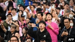 Fans react after not seeing Inter Miami's Argentine forward Lionel Messi play in the friendly football match between Hong Kong XI and U.S. Inter Miami CF in Hong Kong, Feb. 4, 2024.