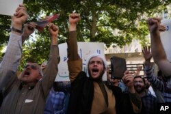 سویڈن میں قرآن کی بے حرمتی پر احتجاج فوٹو اے پی