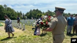 Hundreds of strangers turned out to say goodbye to former U.S. Marine Gerry Brooks as he is laid to rest at the Maine Veterans Memorial Cemetery in Augusta, Maine, June 20, 2024.