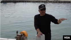 Fisherman Kotaro Kobari, seen here in March 2023, was at sea in August 2022 when a Chinese ballistic missile struck nearby. (W.Gallo/VOA)