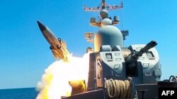 This grab taken from a handout footage shows a Russian Black Sea Fleet warship firing a cruise missile during drills in the Black Sea, July 21, 2023. (Russian Defense Ministry/AFP)