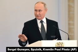 Russian President Vladimir Putin delivers a speech during a ceremony to present Gold Star medals to Heroes of Russia at the St. George Hall of the Grand Kremlin Palace in Moscow on Dec. 8, 2023.