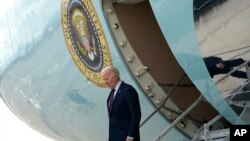 President Joe Biden arrives on Air Force One at Harry Reid International Airport in Las Vegas, Nevada, Feb. 4, 2024.