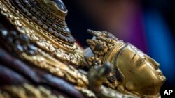 Masks of Hindu deity Lord Bhairabh dated from 16th century that were stolen from Dolakha district are displayed during a press conference at the Department of Archaeology in Kathmandu, Nepal, Jan. 31, 2024.