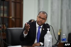 FILE - Geoffrey Starks, an FCC Commissioner, speaks in Washington, June 24, 2020.