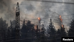 Fires blaze after Lebanon's Hezbollah said it launched more than 200 rockets and a swarm of drones at Israeli military sites, near the border between Israel and Lebanon on the Israeli side, July 4, 2024.