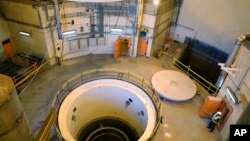 FILE - Technicians work on a heavy water reactor near Arak, Iran, on Dec. 23, 2019. Four Western nations on Dec. 28, 2023, criticized Iran's increased production of highly enriched uranium up to 60% purity. (Atomic Energy Organization of Iran via AP)