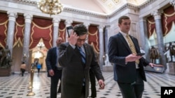 FILE - Republican House Speaker Mike Johnson walks through Statuary Hall as lawmakers gather to vote on the articles of impeachment against Homeland Security Secretary Alejandro Mayorkas, at the Capitol in Washington, Feb. 6, 2024. A first vote last week failed.