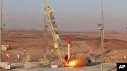 This photo released by the Iranian Defense Ministry on Dec. 6, 2023, claims to show a rocket with a capsule capable of carrying animals, being launched from an undisclosed location into orbit.