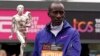 FILE - Men's race winner Kelvin Kiptum of Kenya holds a trophy after the London Marathon in London, Britain, April 23, 2023. Kiptum died in a car crash in Kenya Feb. 11, 2024, at age 24.
