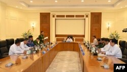 This handout photo taken and released on Jan. 31, 2024 by the Myanmar Military Information Team shows Myanmar's military chief Min Aung Hlaing speaking during a defense and security council meeting in Naypyidaw.