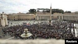 People attend the Angelus prayer led by Pope Francis from his window, at the Vatican, Nov. 12, 2023. (Vatican Media/­Handout via Reuters) 