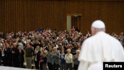 Pope Francis attends a meeting with the faithful of parishes from Rho at the Vatican, March 25, 2023. (Vatican Media/­Handout via Reuters) 