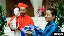 FILE - Cardinal Giorgio Marengo greets friends and family members after being elevated to the rank of cardinal at the Vatican, Aug. 27, 2022. Marengo is in charge of a small Catholic community in Mongolia, where Pope Francis will visit Aug. 31-Sept. 4.