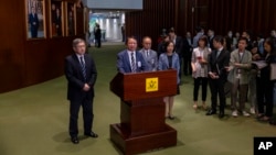 Chief Secretary Eric Chan Kwok-ki speaks to the press after the District Councils (Amendment) Bill, which overhaul district council elections, was passed in Hong Kong, July 6, 2023.
