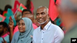 Maldives' main opposition candidate Mohamed Muiz participates in a rally as he concludes his campaign for the second round of presidential election in capital of Male, Sept.29, 2023. 
