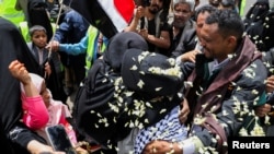 Freed Houthi activist Samira Marish is greeted after arriving on an International Committee of the Red Cross-chartered plane at Sanaa Airport, in Sanaa, Yemen, April 16, 2023. 