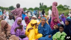 Nigerian Muslim women and children attend Eid al-Adha prayers at an open field in Lagos, June 28, 2023. African Muslim leaders meeting in Cameroon on July 14, 2023, said the idea that women should be allowed to carry out only domestic chores and farm work is an outdated.
