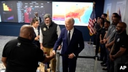 President Joe Biden greets people during a visit to the D.C. Emergency Operations Center, July 2, 2024, in Washington.
