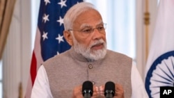 FILE - India's Prime Minister Narendra Modi speaks during a State Visit Luncheon at the State Department, June 23, 2023, in Washington. 
