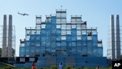 A giant stage built for the international World Youth Day stands in the center of Lisbon, Portugal, July 24, 2023.