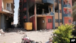 Residential buildings damaged in fighting are seen in Khartoum, Sudan, April 20, 2023. 