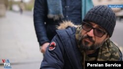 وحید بهشتی در گفت‌و‌گو با صدای آمریکا. او پس از هفته‌ها اعتصاب غذا مجوز ورود به وزارت امور خارجه بریتانیا را دریافت کرد.