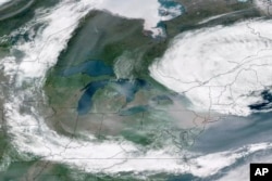 This GOES-16 GeoColor satellite image taken June 7, 2023, at 2:20 p.m. EDT and provided by CSU/CIRA & NOAA, shows a broad view of smoke from Canadian wildfires drifting across the Midwest and Northeast of the United States.