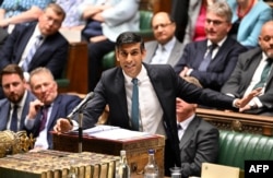A handout photograph taken and released by the UK Parliament shows Britain's Prime Minister Rishi Sunak speaking at the House of Commons in London, June 28, 2023.