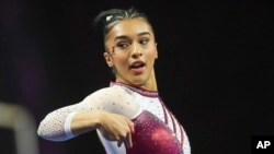 FILE - Luisa Blanco competes on the floor exercise during an NCAA gymnastics meet on Jan. 6, 2024 in Las Vegas. 
