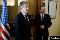 U.S. Secretary of State Antony Blinken meets with Israeli President Isaac Herzog, during his visit to Israel, amid the ongoing conflict between Israel and the Palestinian group Hamas, in Tel Aviv, Israel, Nov. 3, 2023.