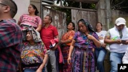 Residents listen to Seed Movement presidential candidate Bernardo Arevalo during a campaign rally in Santa Maria de Jesus, Guatemala, July 16, 2023.
