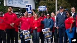President Joe Biden stands with striking United Auto Workers on the picket line outside the Willow Run Redistribution Center, UAW Local 174, Sept. 26, 2023, in Van Buren Township, Mich.