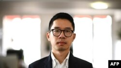 FILE - Hong Kong pro-democracy activist and former legislator Nathan Law poses during a photo session at the Reporters Sans Frontieres (RSF - Reporters Without Borders) headquarters in Paris on June 21, 2022. 