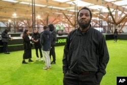 Job seeker Starsky-Aldo Fandio, at a jobs fair in Paris on Dec. 14, 2023, hopes an Olympics job will lead to longer-term work.