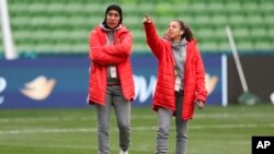 Morocco's Nouhaila Benzina, left, and Fatima Gharbi tour the grounds before their Women's World Cup Group H match against Germany in Melbourne, Australia, July 23, 2023. Benzina will be the first player to wear an Islamic headscarf at the senior-level Women's World Cup.