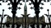 FILE - The Canadian Parliament building is framed through a gate on Parliament Hill in Ottawa, Ontario.