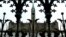 FILE - The Canadian Parliament building is framed through a gate on Parliament Hill in Ottawa, Ontario.