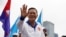 Hun Manet, son of Cambodia's Prime Minister Hun Sen, waves to people during the final Cambodian People's Party campaign stop for the upcoming general election, in Phnom Penh, Cambodia, July 21, 2023. 