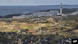 This aerial photo shows Shika nuclear power plant, rear, in Shika, on the western coast of the quake-struck Noto peninsula, Ishikawa prefecture, Japan, on Jan. 28, 2024.